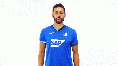 a man wearing a blue shirt with the word sap on the front