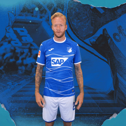 a man wearing a blue shirt with the word sap on the front