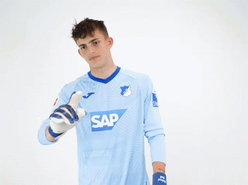 A Man Wearing A Blue Shirt With The Word Sap On The Front GIF