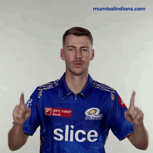 A Man Wearing A Blue Shirt With The Word Slice On The Front GIF