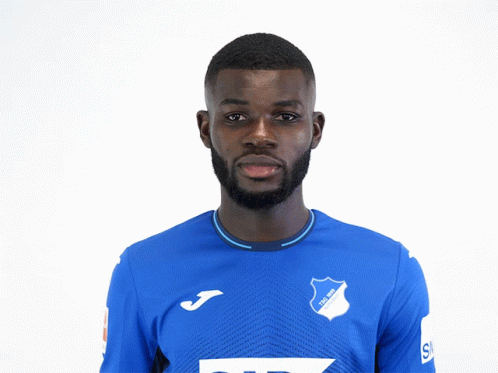 a man wearing a blue shirt with tsg 1899 written on it