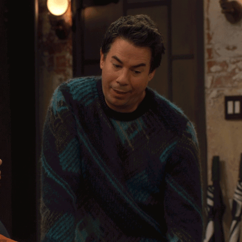 A Man Wearing A Blue Sweater Says I Love It GIF