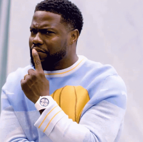 A Man Wearing A Blue Sweater With A Yellow Basketball On It GIF