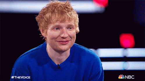 A Man Wearing A Blue Sweater With The Word Nbc On It GIF