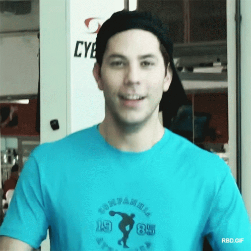 A Man Wearing A Blue T-Shirt That Says Companions 1985 GIF