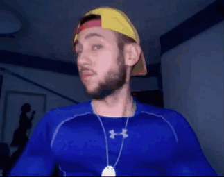 A Man Wearing A Blue Under Armour Shirt And A Hat GIF