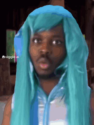A Man Wearing A Blue Wig And A White Shirt Has The Hashtag Viggles Ai On The Bottom GIF