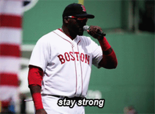 A Man Wearing A Boston Jersey Holds A Microphone GIF