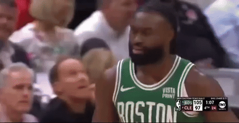 A Man Wearing A Boston Jersey Stands In Front Of A Crowd During A Basketball Game GIF