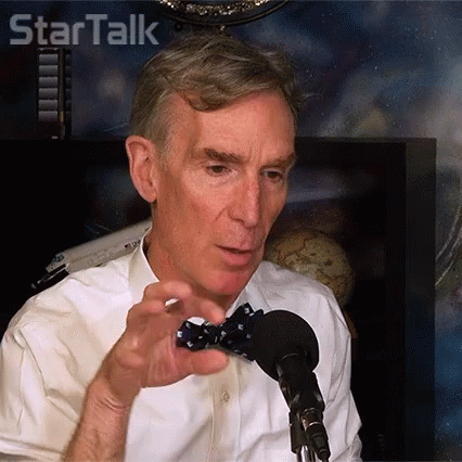 A Man Wearing A Bow Tie Talks Into A Microphone In Front Of A Sign That Says Star Talk GIF