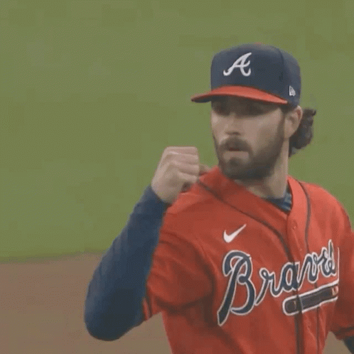 A Man Wearing A Braves Jersey And A Hat GIF
