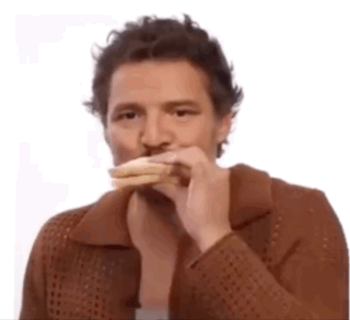 A Man Wearing A Brown Jacket Is Eating A Sandwich . GIF