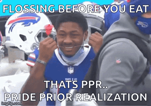 A Man Wearing A Buffalo Bills Jersey Is Flossing His Teeth GIF