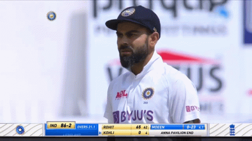 A Man Wearing A Byju 'S Shirt Looks At The Scoreboard During A Cricket Match GIF