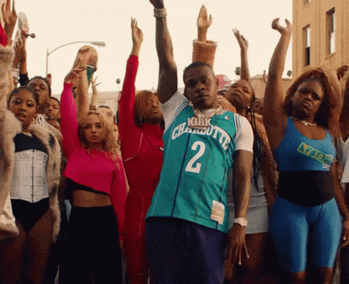A Man Wearing A Charlotte Jersey Number 2 Stands In Front Of A Crowd Of People GIF