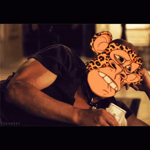 A Man Wearing A Cheetah Mask Is Holding A Cup Of Coffee GIF