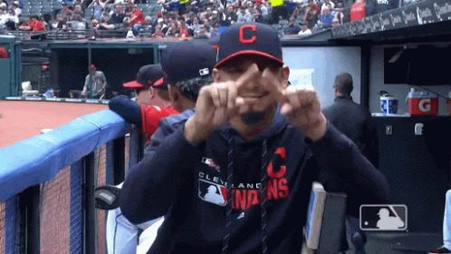 A Man Wearing A Cleveland Indians Sweatshirt Makes A Funny Face GIF