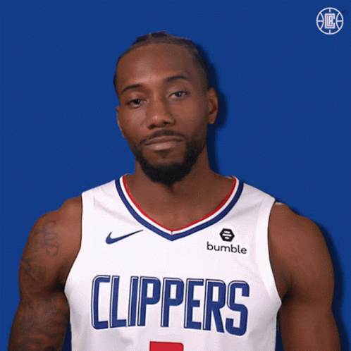 A Man Wearing A Clippers Jersey With A Bumble Logo On It GIF
