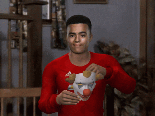 A Man Wearing A Clown Mask And A Red Chevrolet Shirt GIF