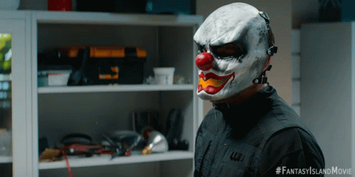 A Man Wearing A Clown Mask Has The Hashtag Fantasyislandmovie On The Bottom GIF