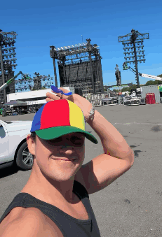 A Man Wearing A Colorful Hat Takes A Selfie GIF