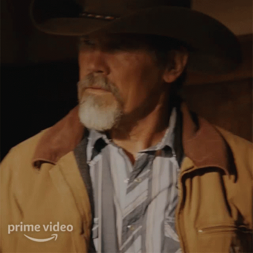 A Man Wearing A Cowboy Hat And A Brown Jacket Has A Prime Video Logo On The Bottom Right GIF