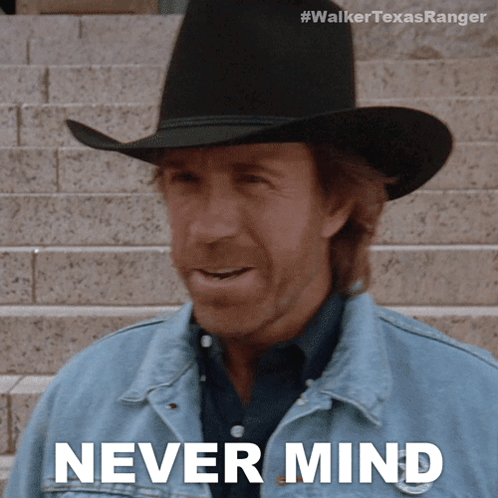 A Man Wearing A Cowboy Hat And A Denim Jacket Says Never Mind GIF