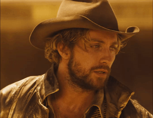 Man In Cowboy Hat And Leather Jacket GIF