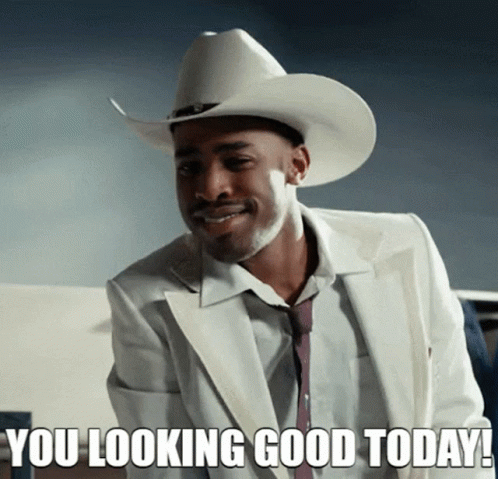A Man Wearing A Cowboy Hat And A White Suit Says " You Looking Good Today " GIF