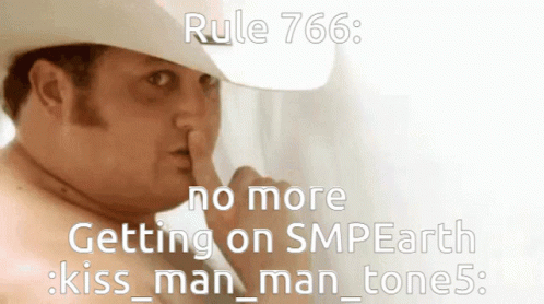A Man Wearing A Cowboy Hat Is Making A Silence Gesture GIF