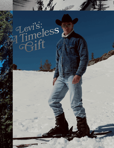 A Man Wearing A Cowboy Hat Is Standing On Skis In The Snow With The Words Levi 'S Timeless Gift Behind Him GIF