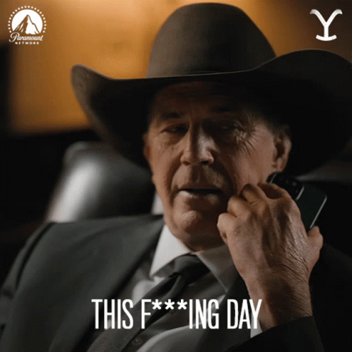 A Man Wearing A Cowboy Hat Is Talking On A Cell Phone With The Words This F *** Ing Day Below Him GIF