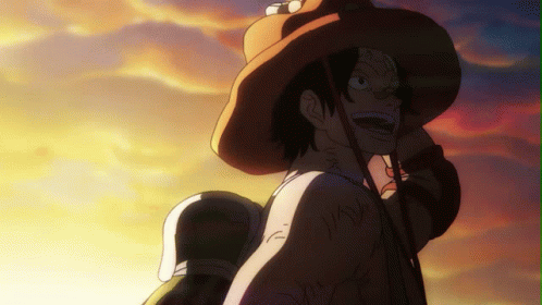 A Man Wearing A Cowboy Hat Looks At The Sunset GIF