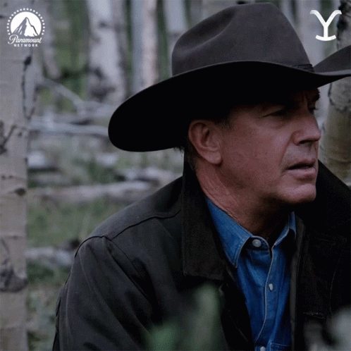 A Man Wearing A Cowboy Hat With The Letter Y On It GIF