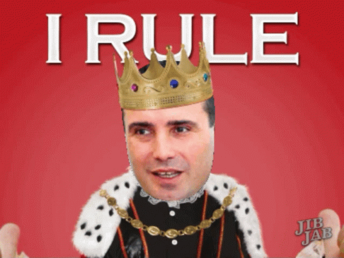 A Man Wearing A Crown And A King 'S Robe With The Word I Rule Above Him GIF