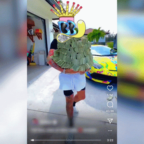 A Man Wearing A Crown And Holding A Pile Of Money GIF