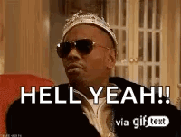A Man Wearing A Crown And Sunglasses Is Sitting In A Chair And Saying Hell Yeah . GIF