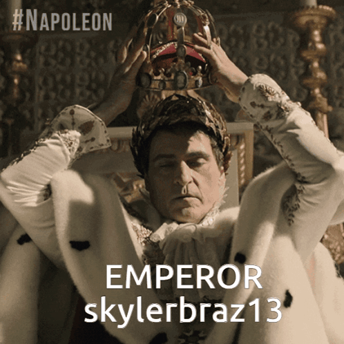 A Man Wearing A Crown With The Word Emperor On It GIF