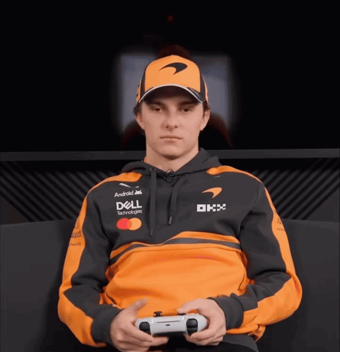 A Man Wearing A Dell Hoodie Is Holding A Playstation Controller GIF