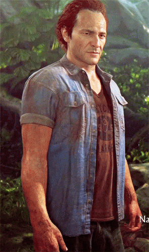 A Man Wearing A Denim Shirt And A Brown T-Shirt With The Word Army On The Front GIF