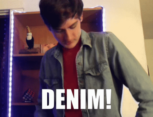 A Man Wearing A Denim Shirt With The Word Denim Written On It GIF