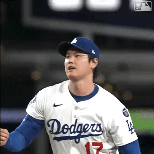 A Man Wearing A Dodgers Jersey With The Number 17 GIF