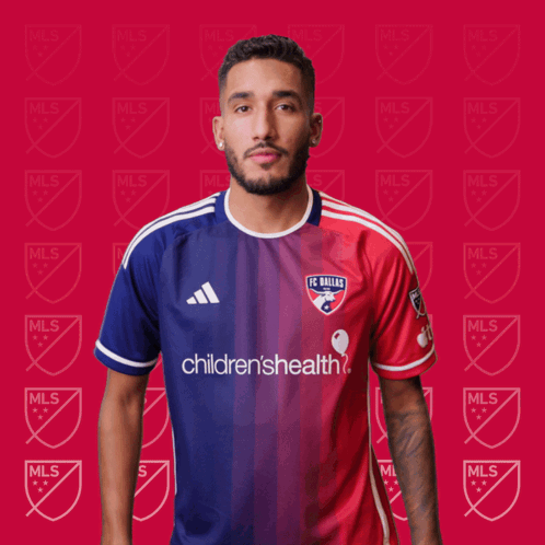 A Man Wearing A Fc Dallas Jersey Is Clapping His Hands GIF