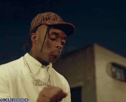 A Man Wearing A Fendi Hat And A Necklace With The Word Kurrco Below Him GIF