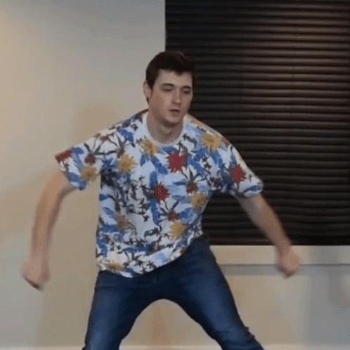 Man Dancing In Floral Shirt And Jeans GIF