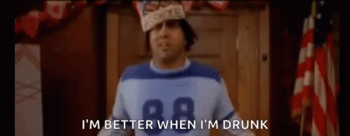 a man wearing a football jersey and a hat says i 'm better when i 'm drunk