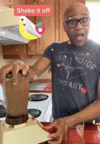 A Man Wearing A Ford Motor Company Shirt Shakes A Blender GIF