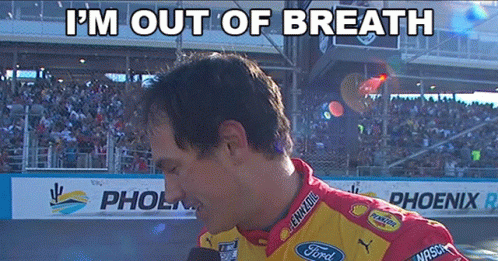A Man Wearing A Ford Shirt Is Talking Into A Microphone GIF