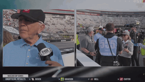 A Man Wearing A Fox Sports Microphone Talks To A Group Of People GIF