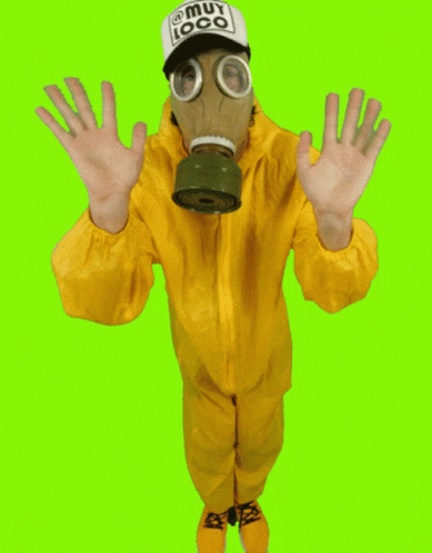 A Man Wearing A Gas Mask And A Hat That Says Muy Loco On It GIF